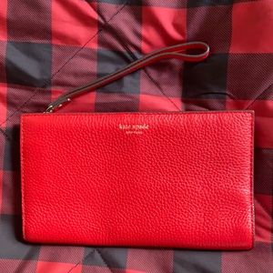 Red leather kate spade wristlet.